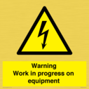 warning-work-in-progress-on-equipmentwith-electrical-hazard-symbol~